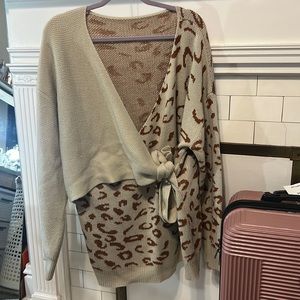 Cute soft wrap sweater . Very flattering